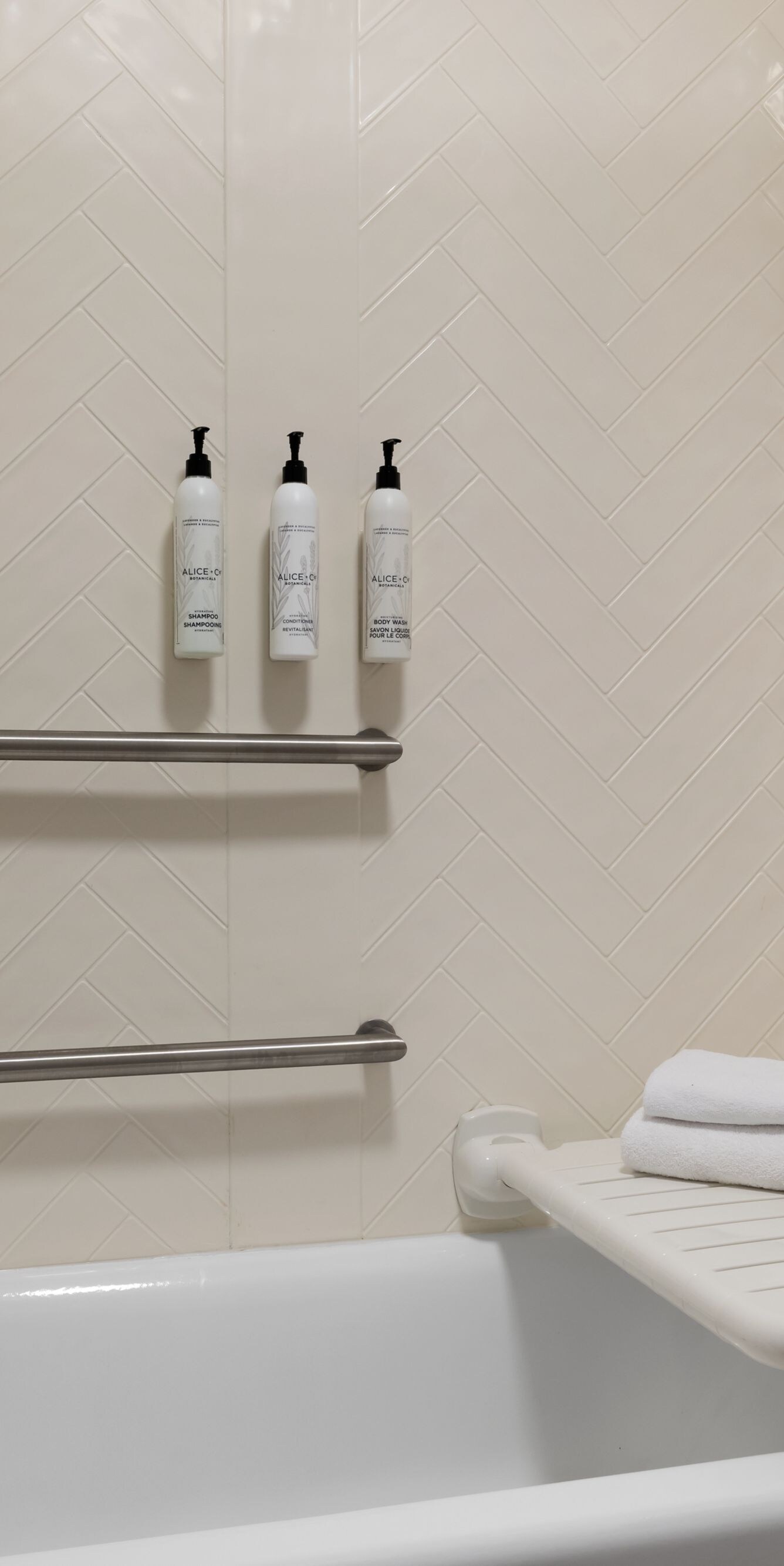 bathtub with grab bars and transfer seat