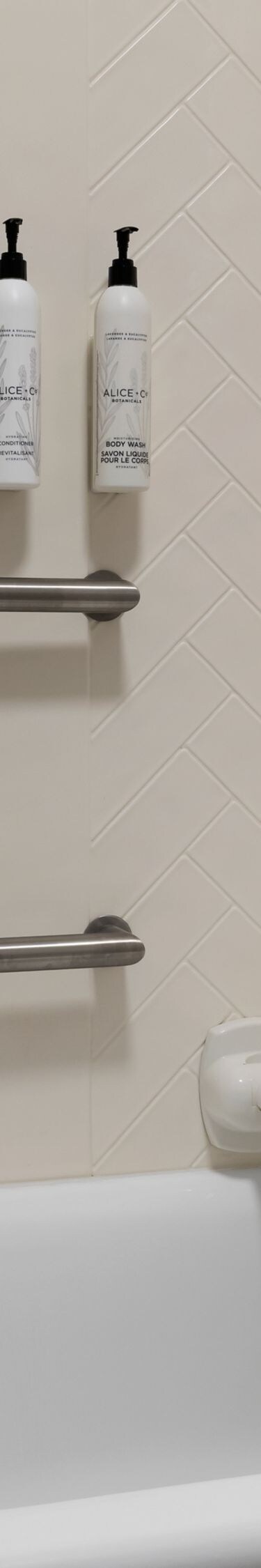 bathtub with grab bars and transfer seat