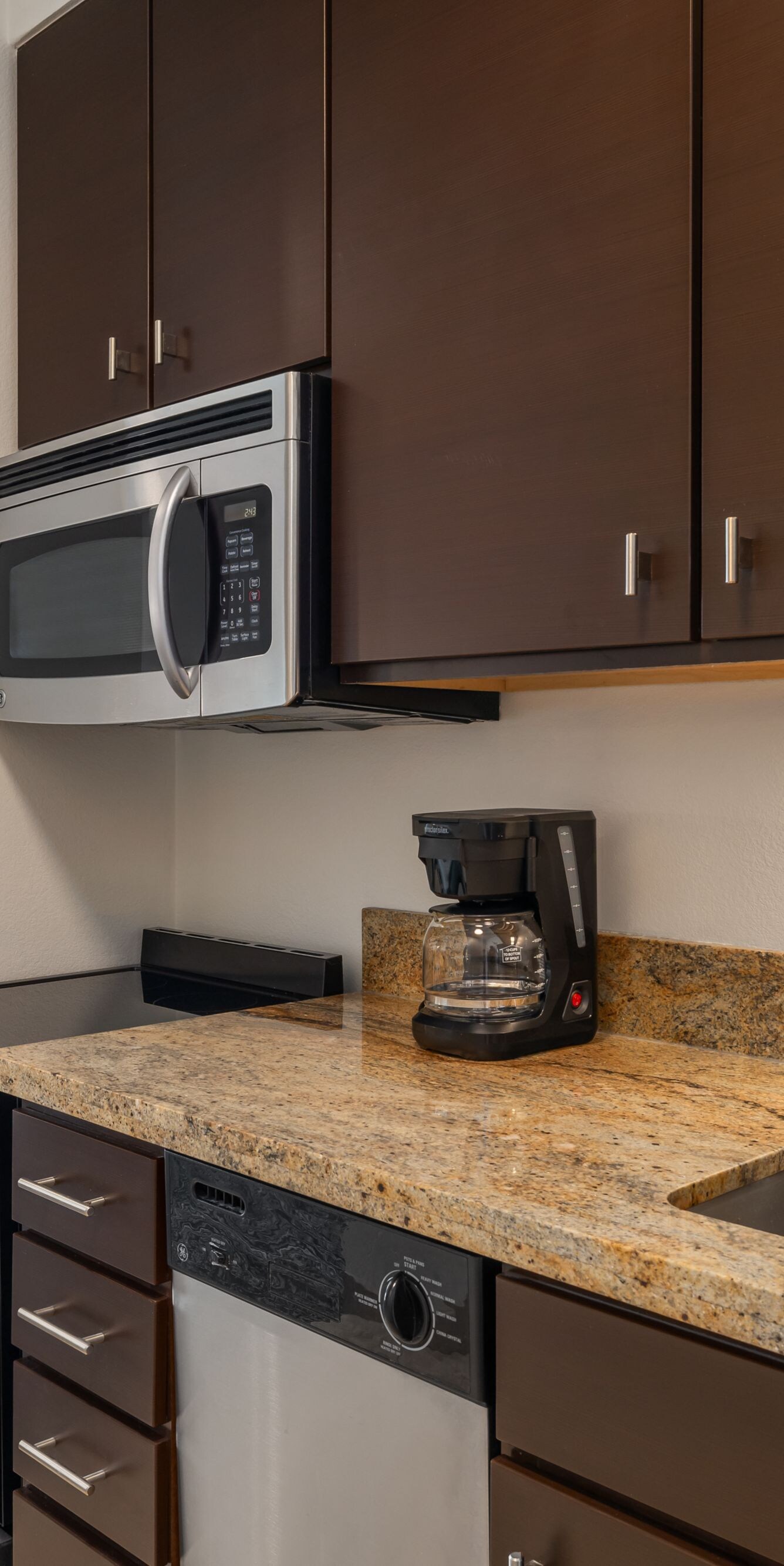 full kitchen, work desk, and tv