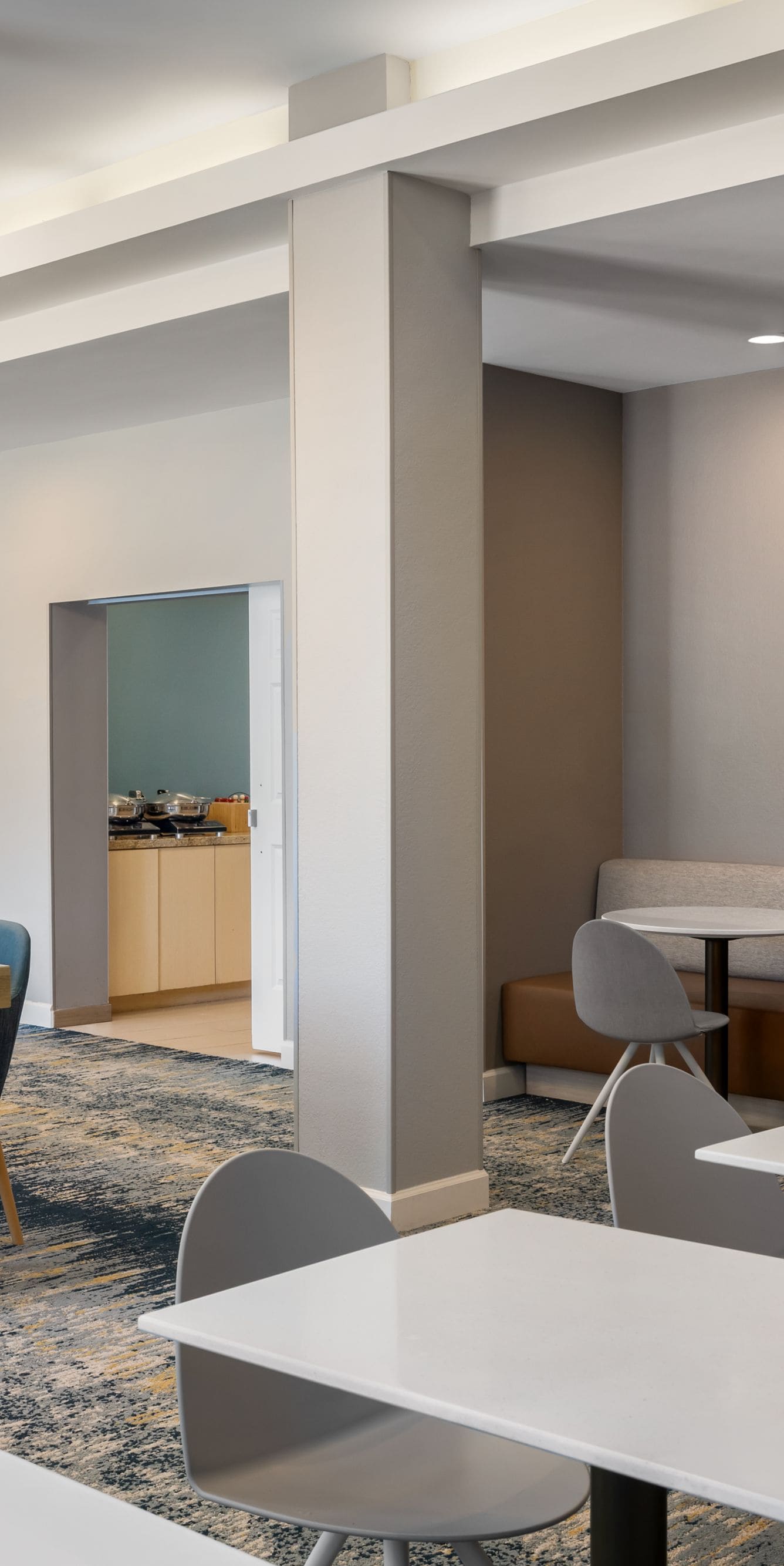 Hotel breakfast lounge with tables and seating