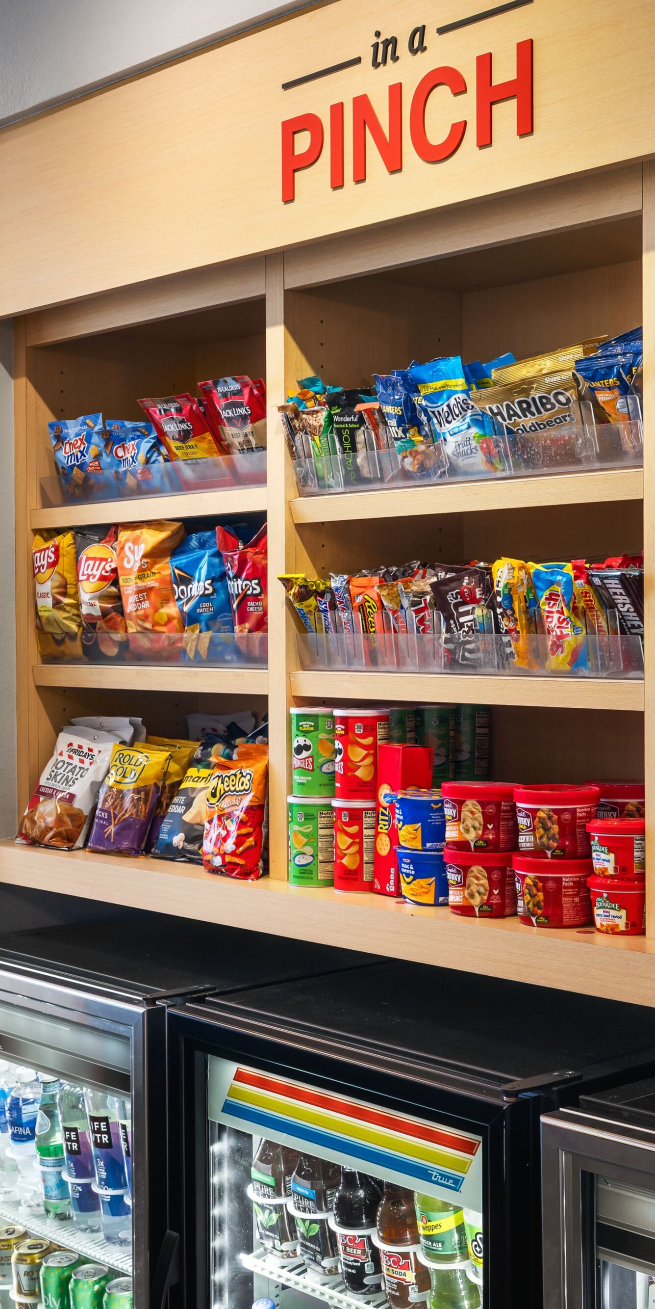 pantry shelves with snacks and beverages displayed