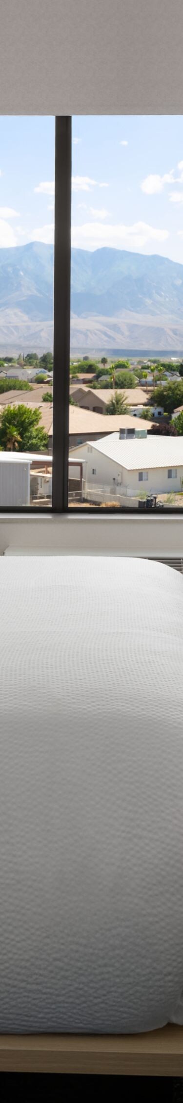 accessible bedroom with bed, tv, and storage