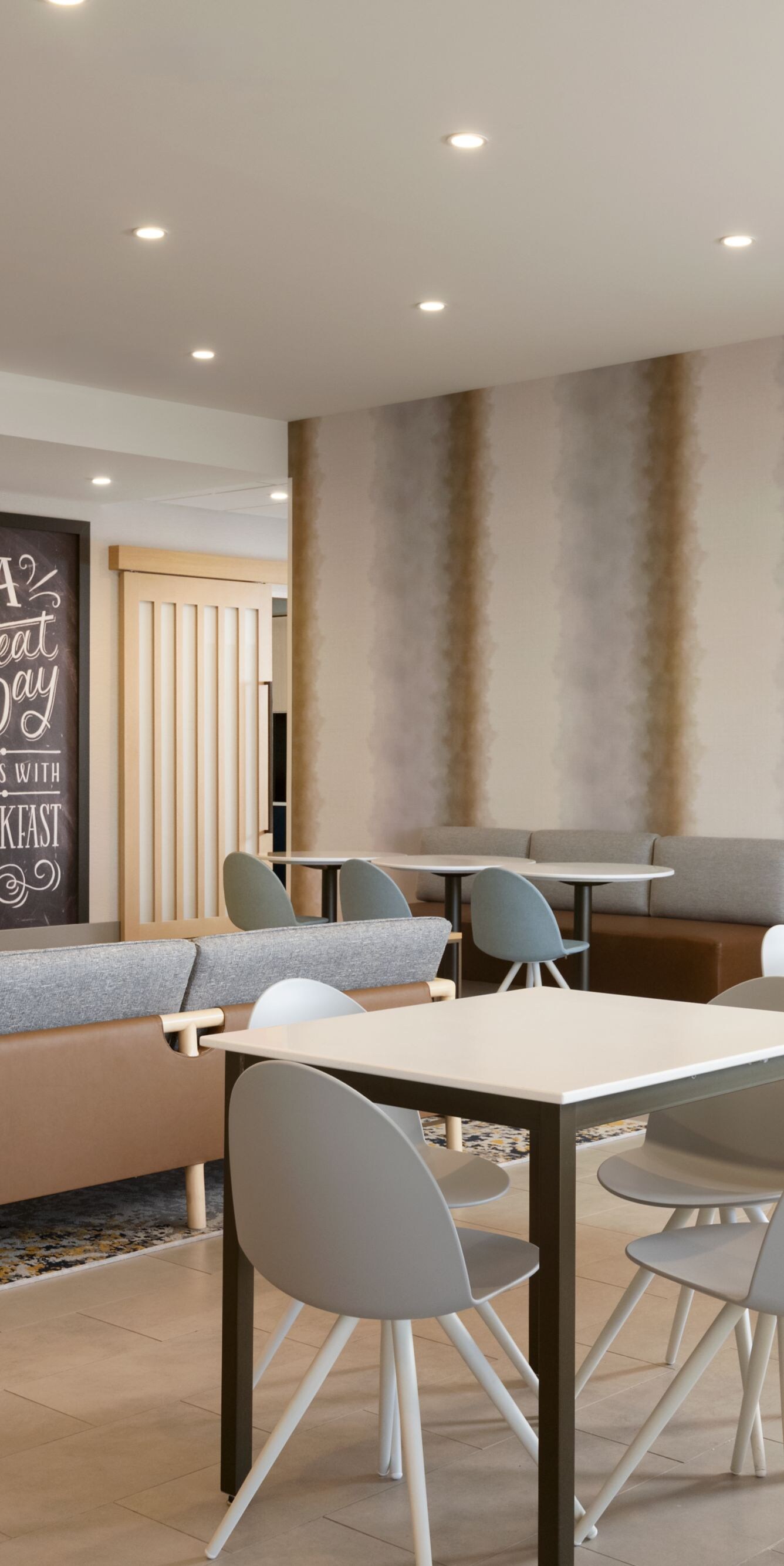 Breakfast seating area with tables and chairs