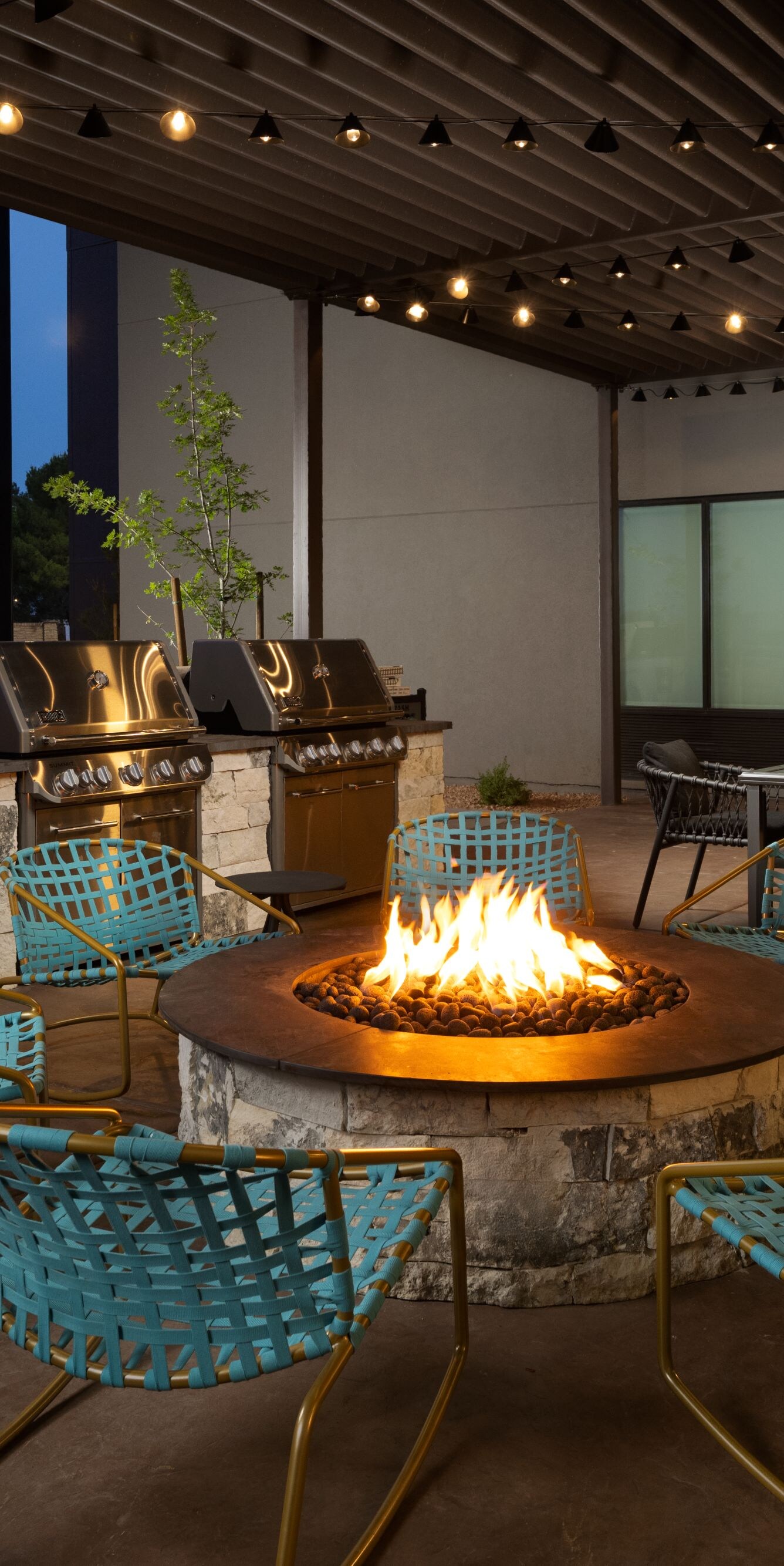 patio with fire pit and grills for guests to use