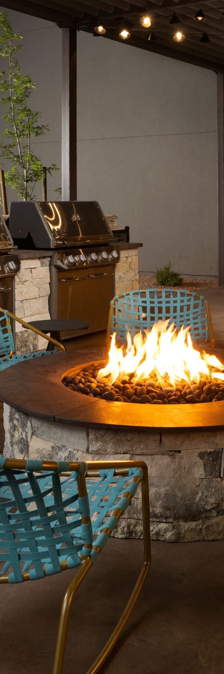 patio with fire pit and grills for guests to use