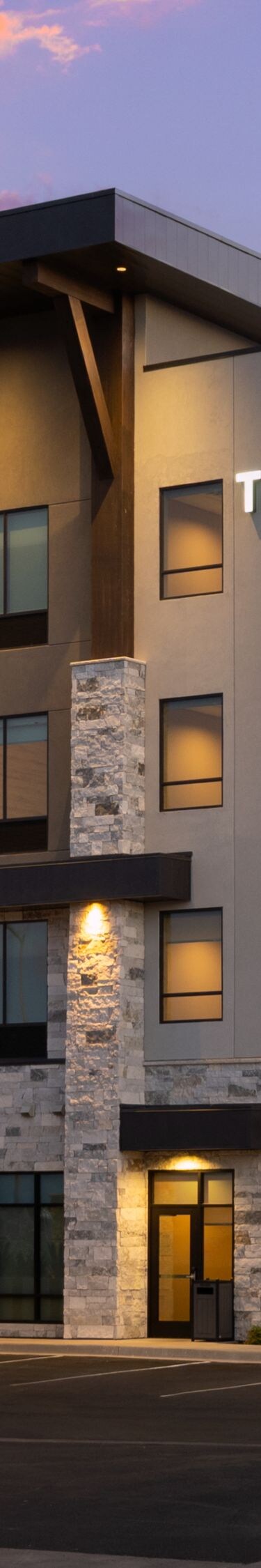 Exterior view of hotel at dusk