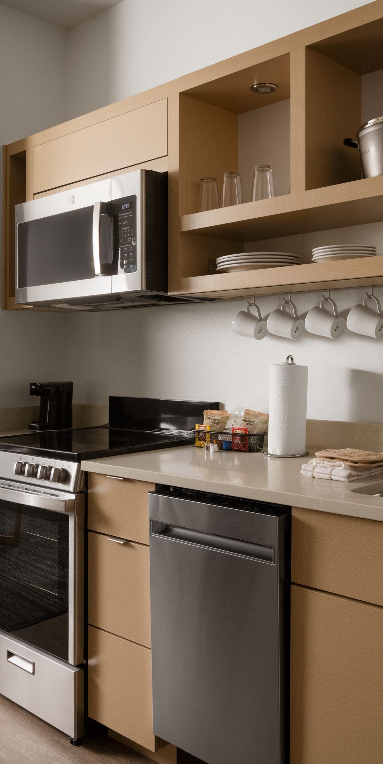 Kitchenette with dishwasher, oven, stove, and more