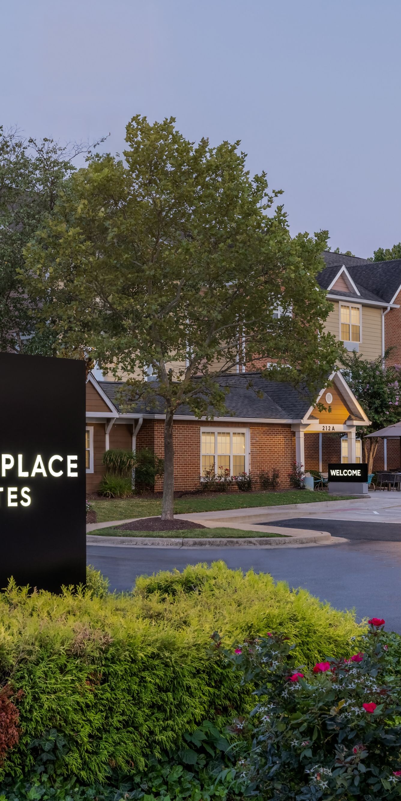 entrance of hotel featuring property signage