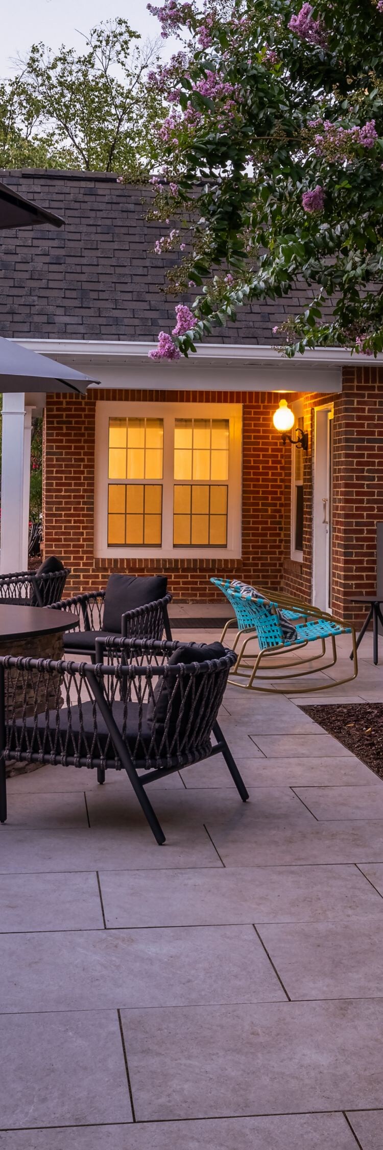 outdoor patio at dusk with seating and fire pit