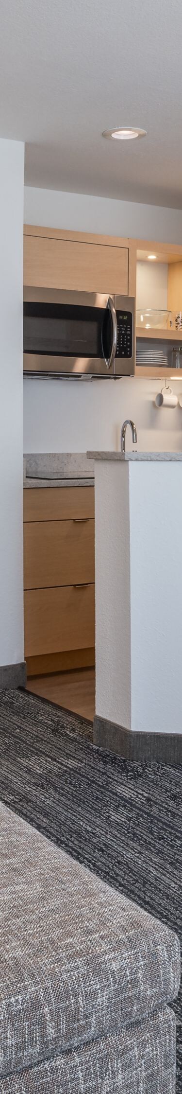 Studio suite with kitchen, desk, bed, sofa