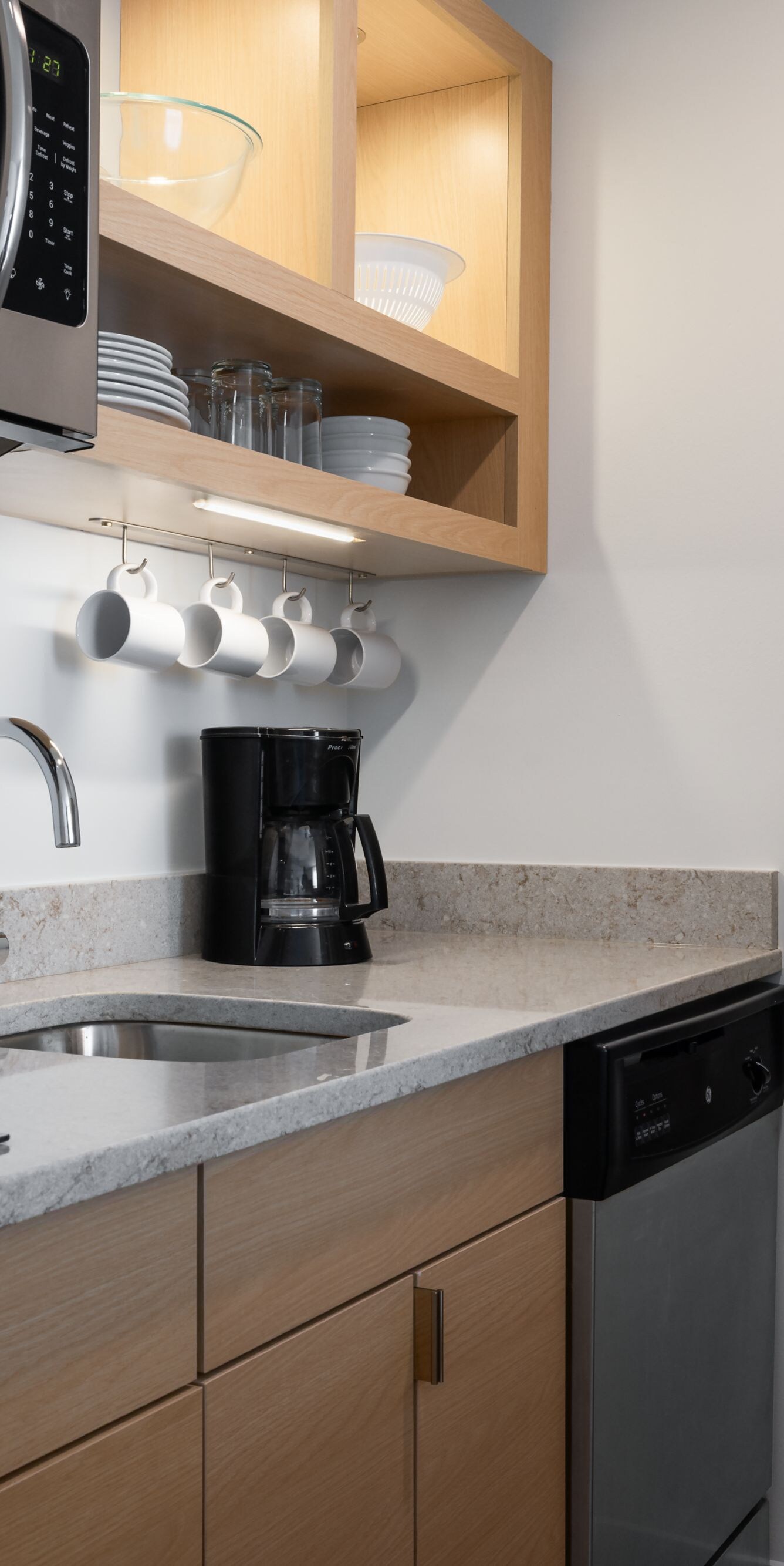 Suite kitchen with sink, cooktop, microwave