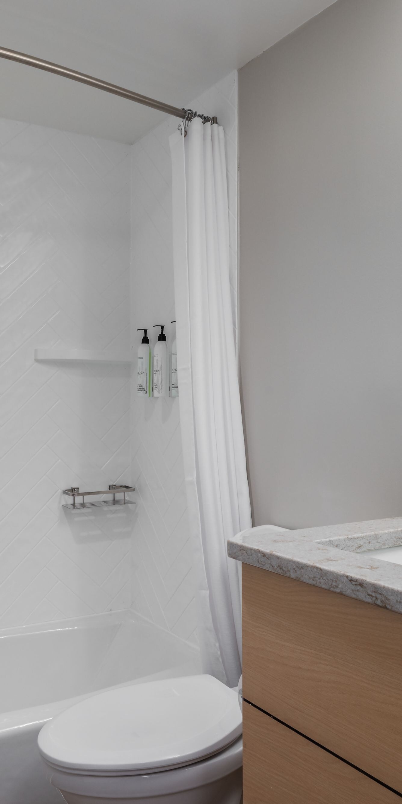 Bathroom with tub shower and vanity