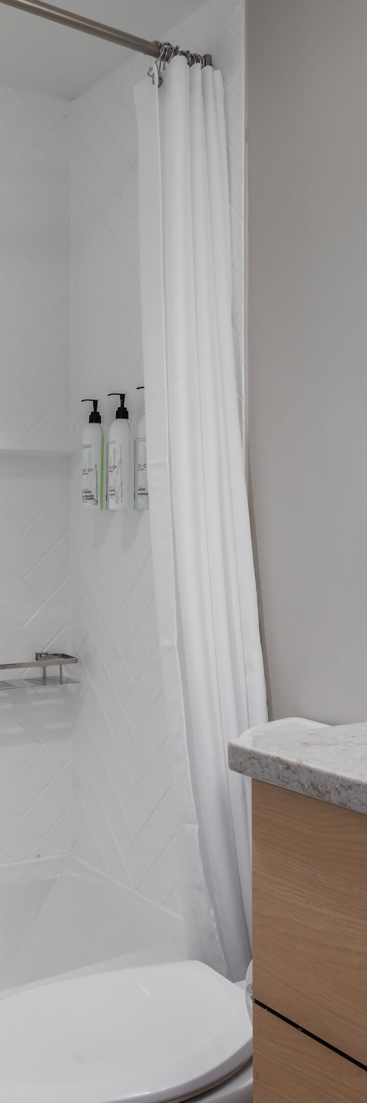 Bathroom with tub shower and vanity