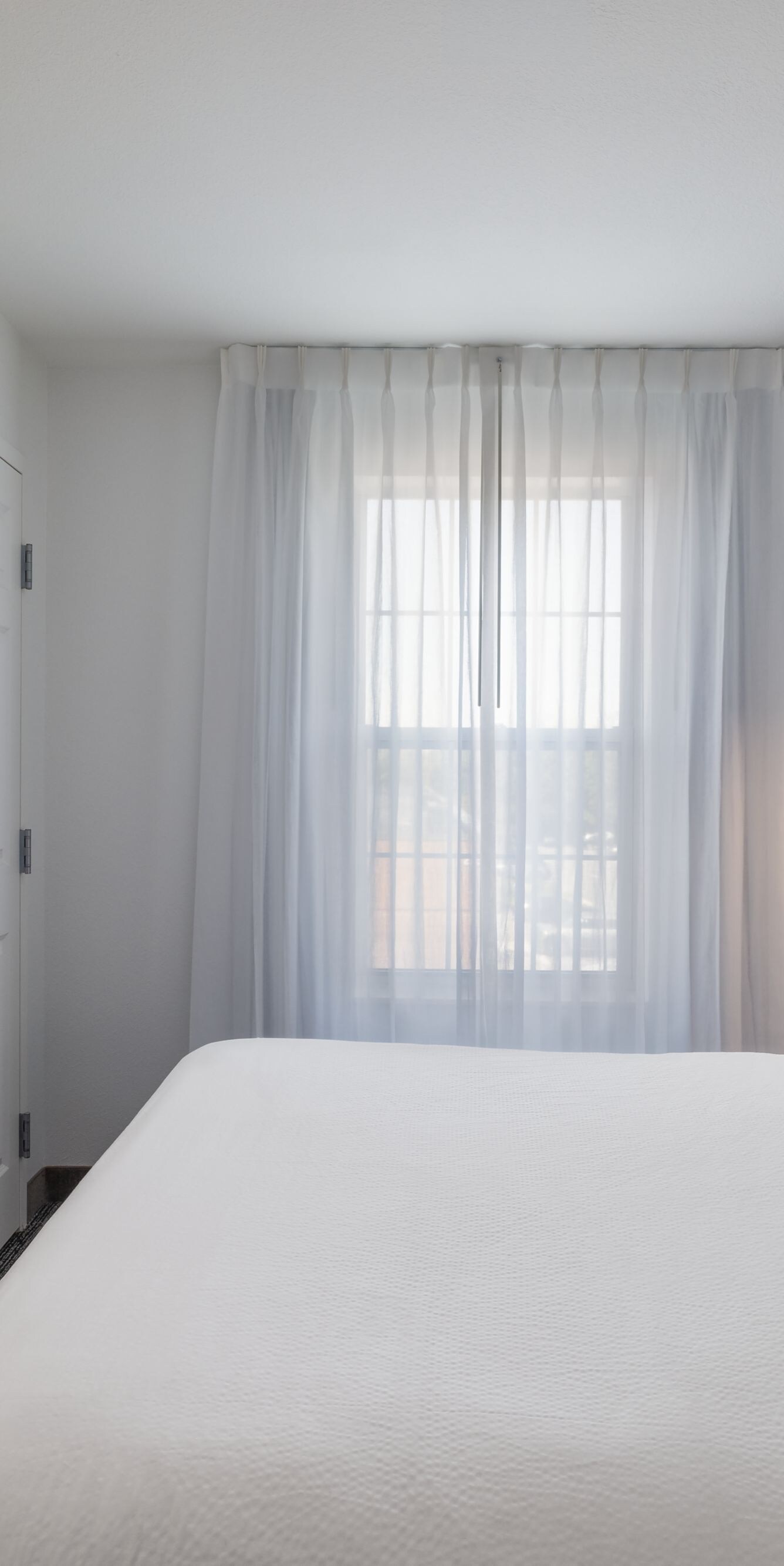 Second bedroom with bed and window