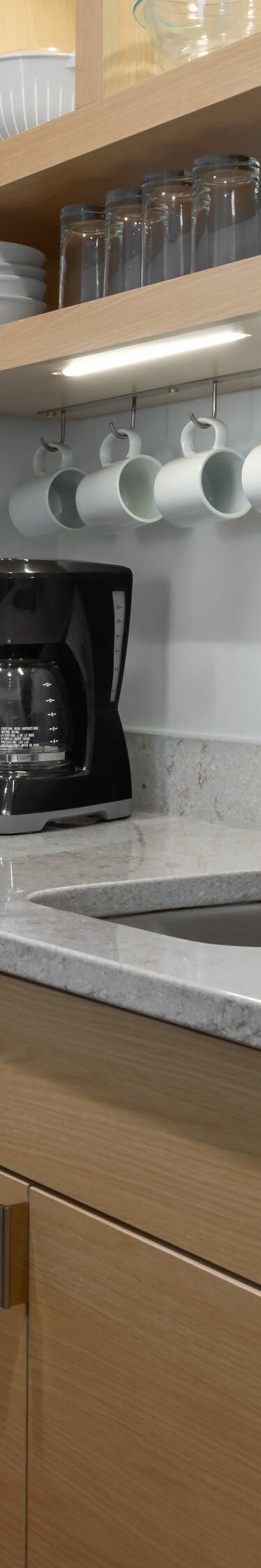 Suite kitchen with stove, sink, microwave