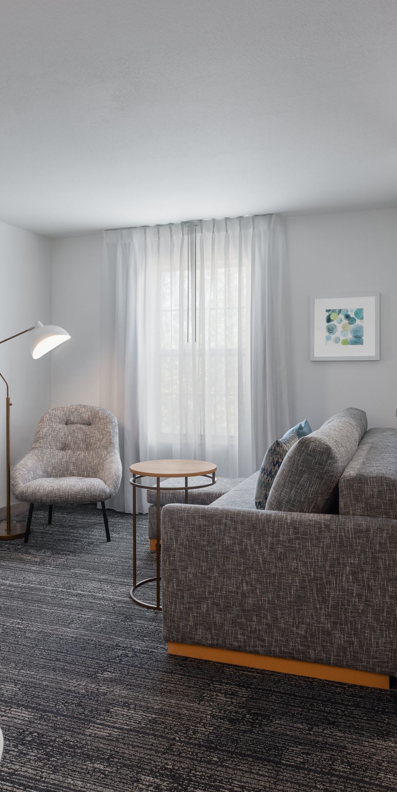 Suite living area with kitchen and sofa