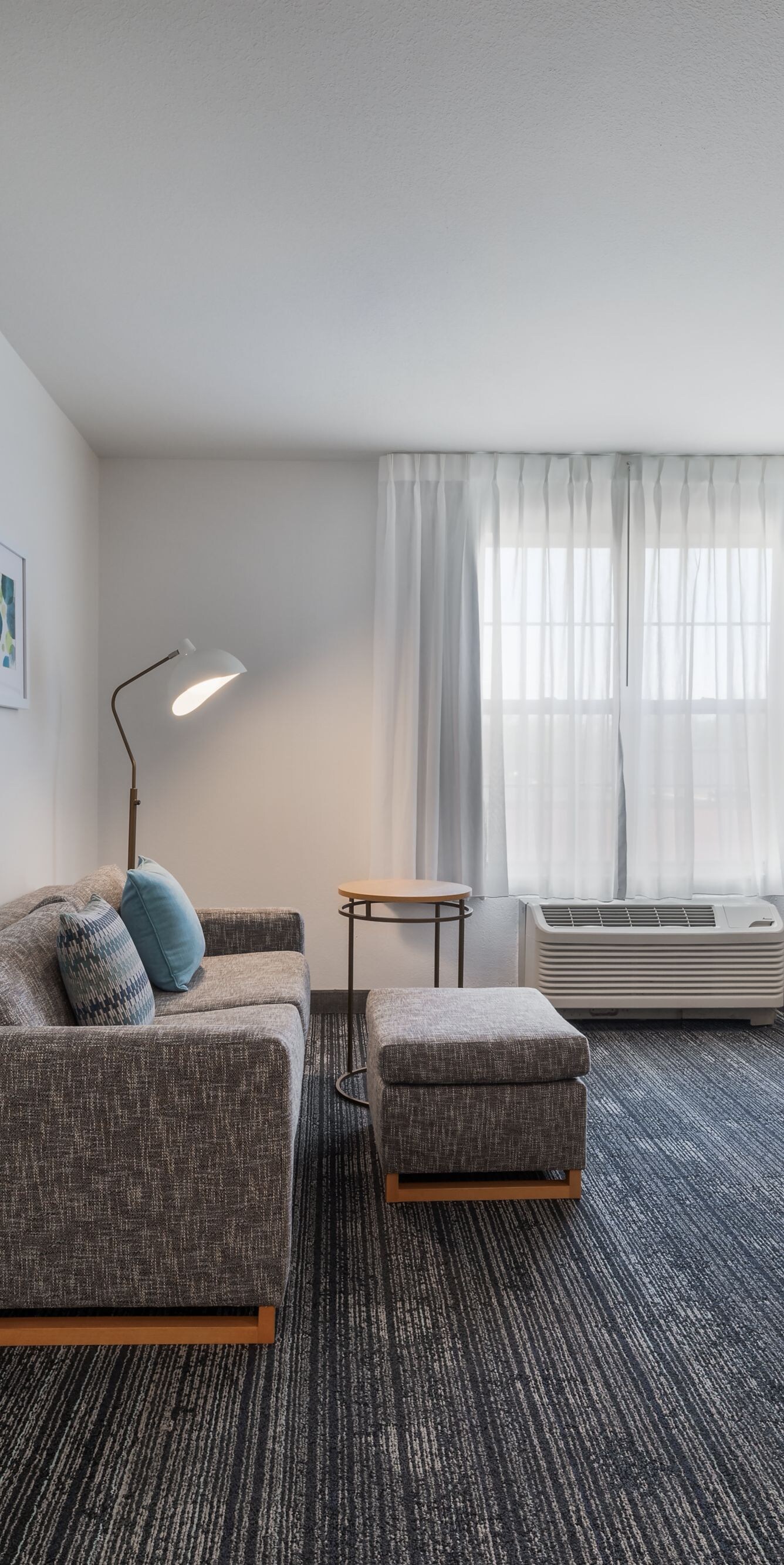 Suite living area with sofa and bedroom