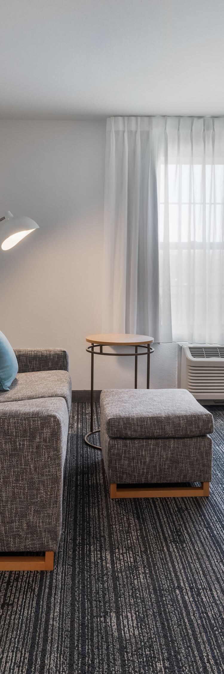 Suite living area with sofa and bedroom