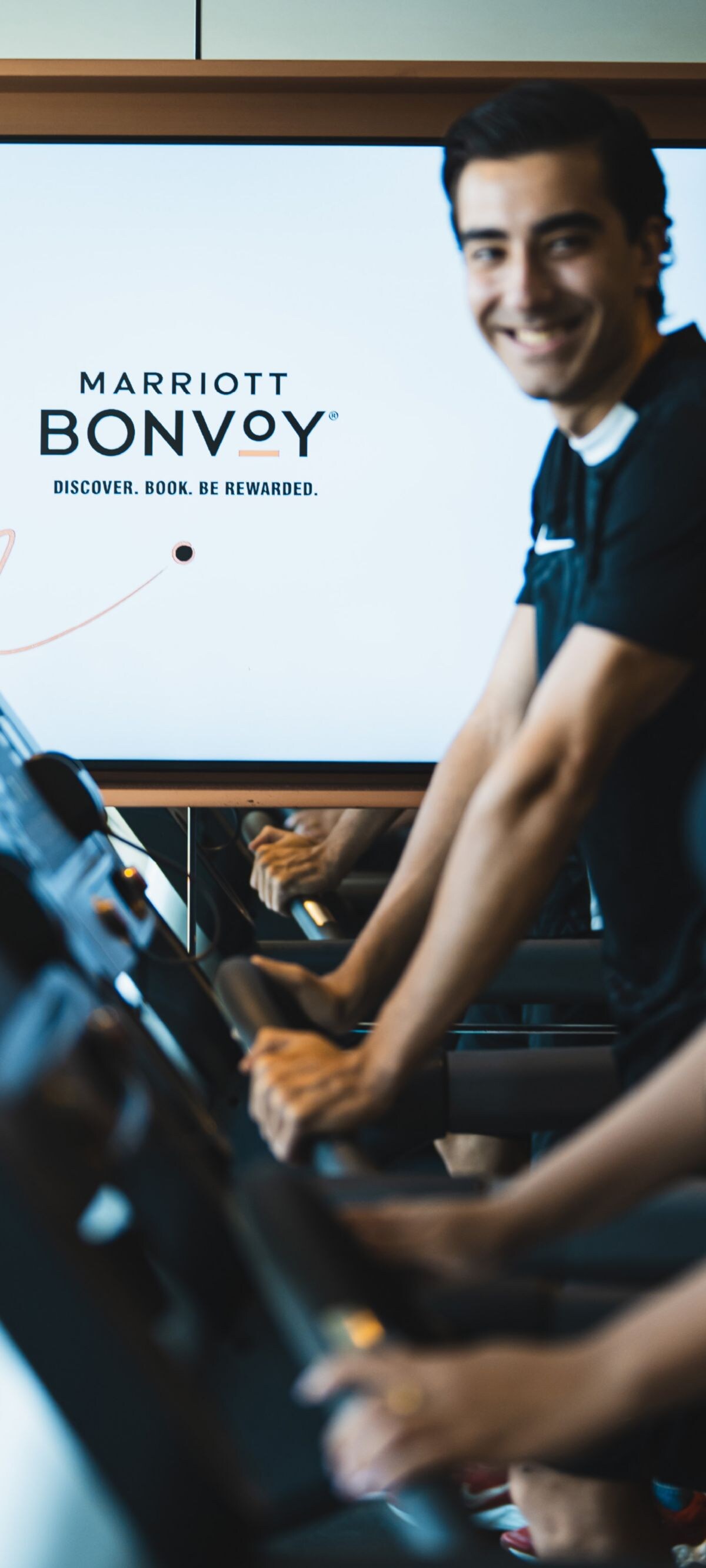 Guests exercising on treadmills in a hotel gym