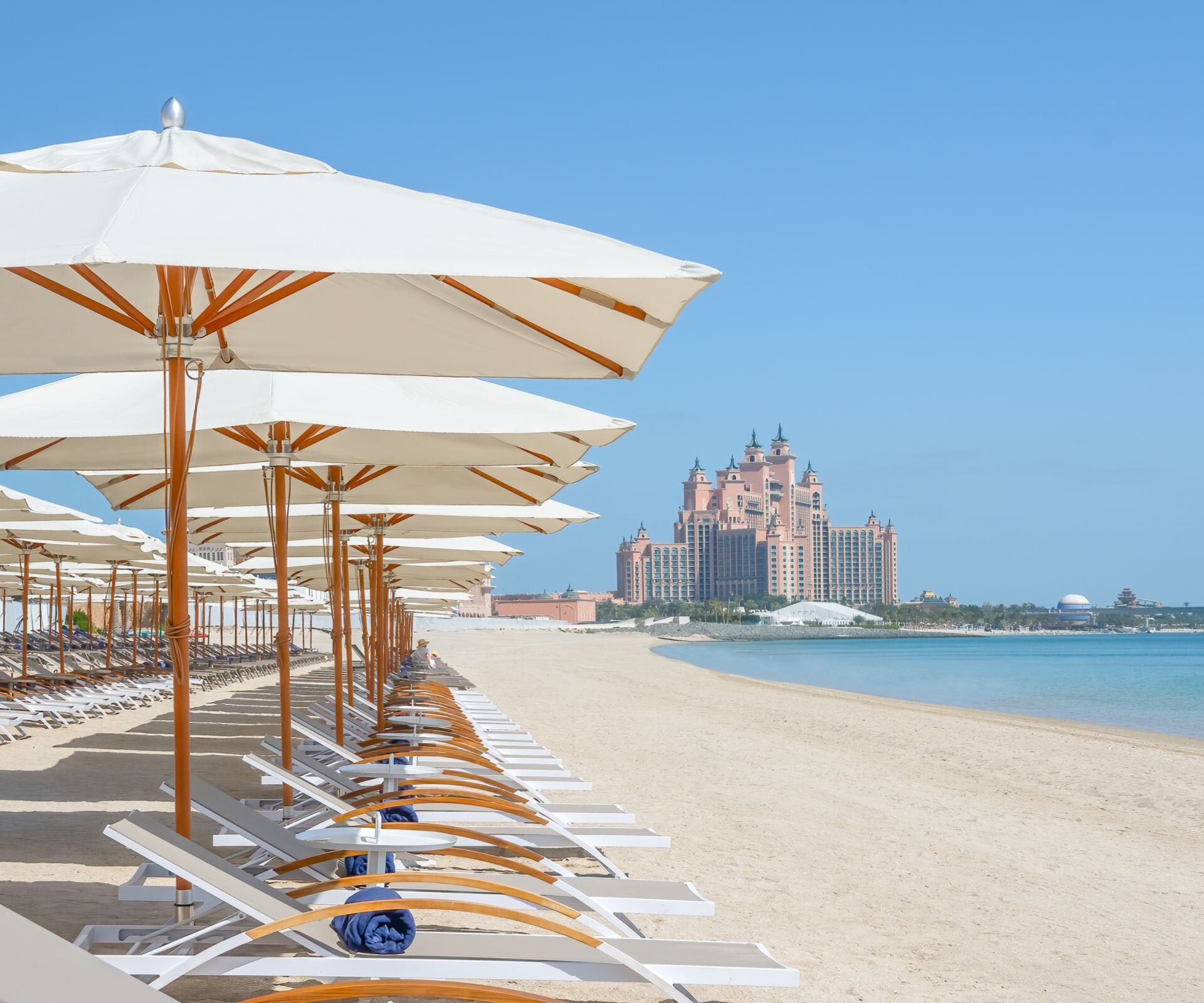 Sun loungers on the beach at Soluna Beach Club 