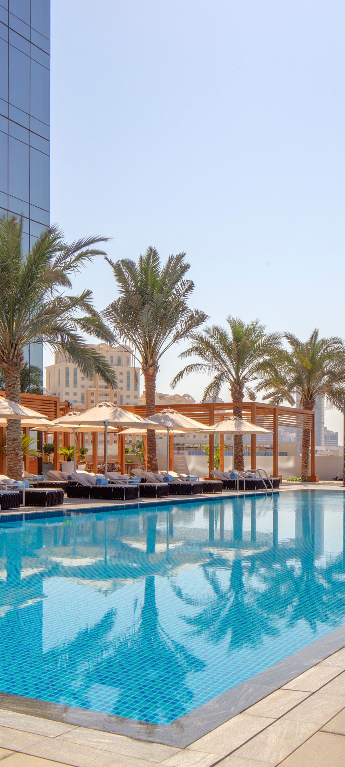 Hotel swimming pool and lounge chairs