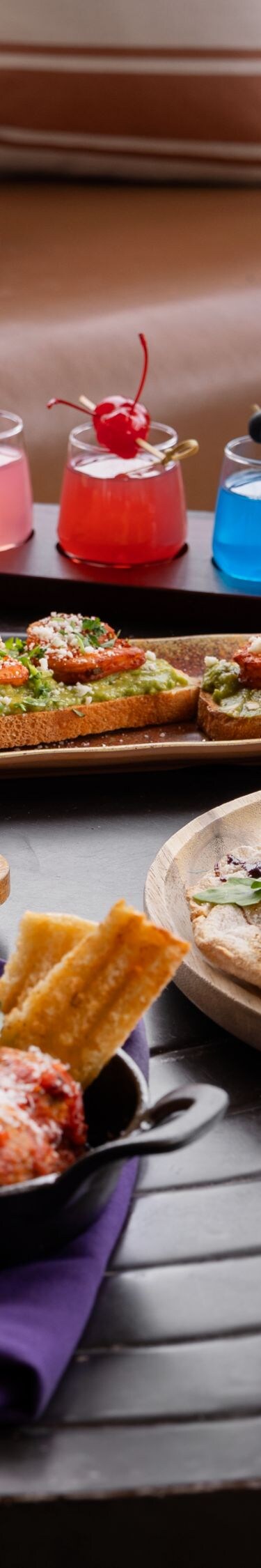 Gourmet appetizers and cocktails on table