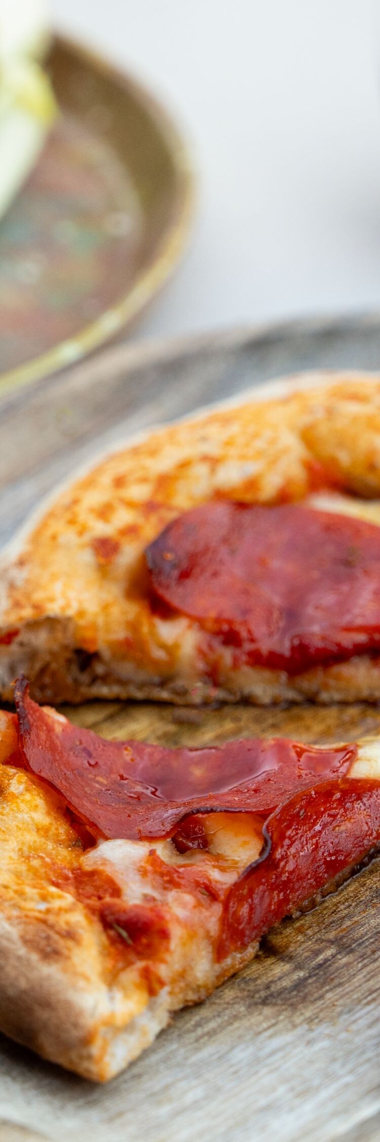 Pepperoni pizza with salad and red wine