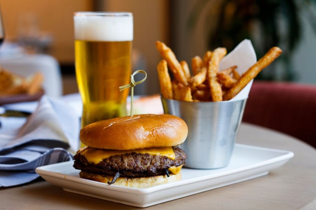 burger and fries with a beer