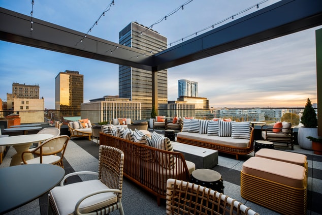 City views from a rooftop with outdoor furniture