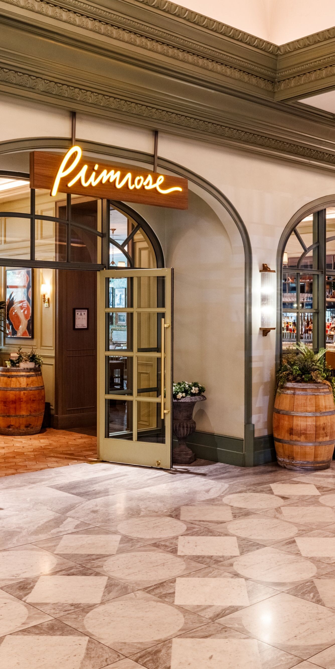 Restaurant entrance, glass doors in open position.