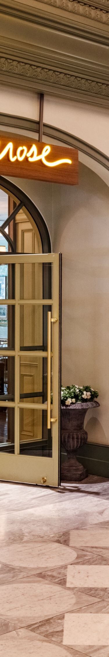 Restaurant entrance, glass doors in open position.