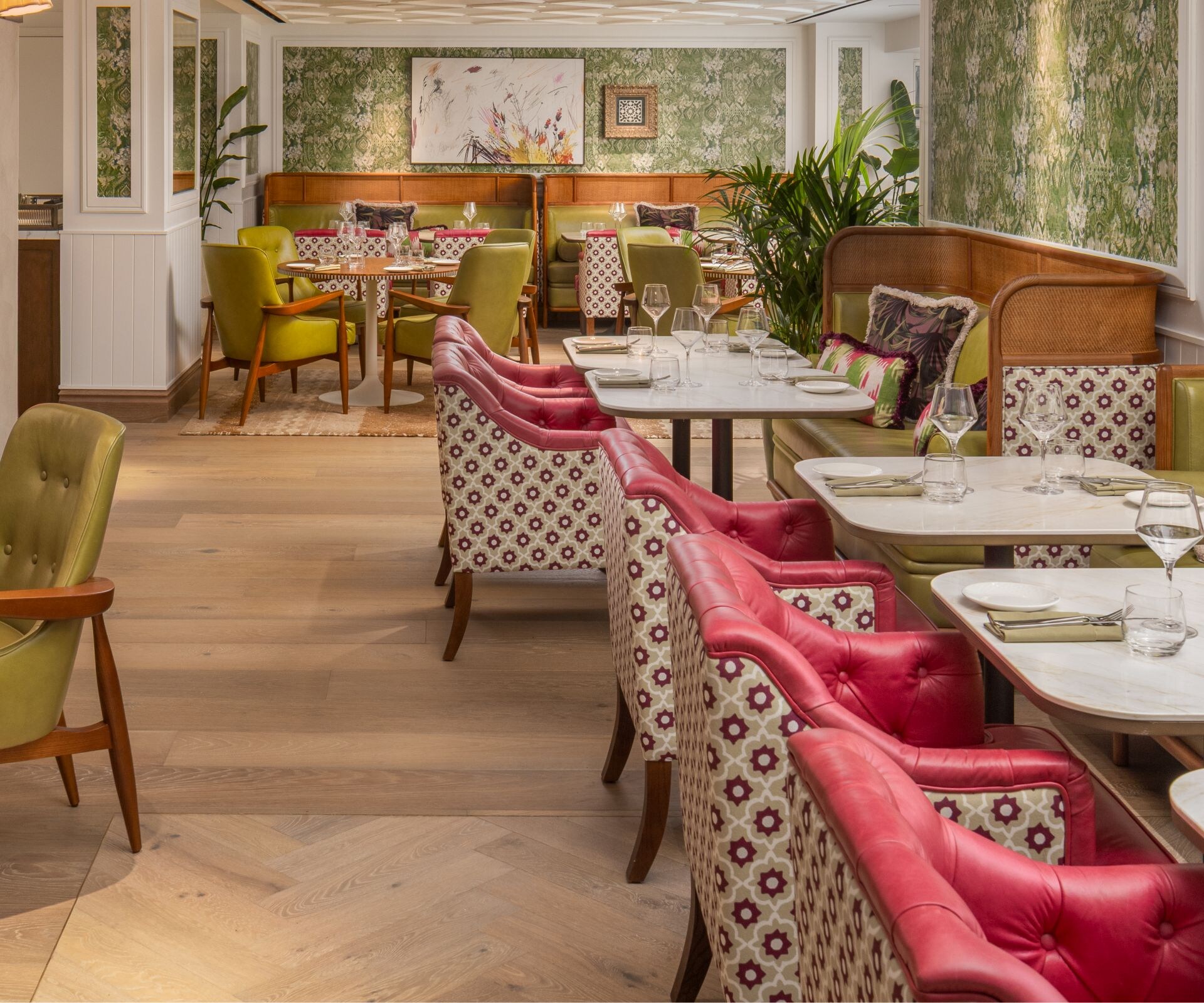 Pink and green accented restaurant with artwork