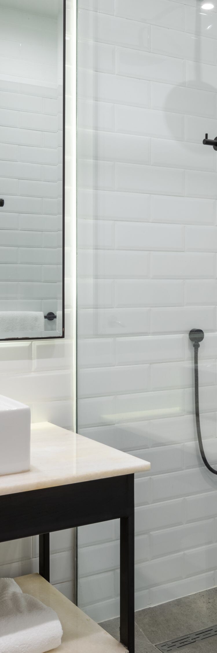 vanity, vessel sink, shower, mirror, glass shower