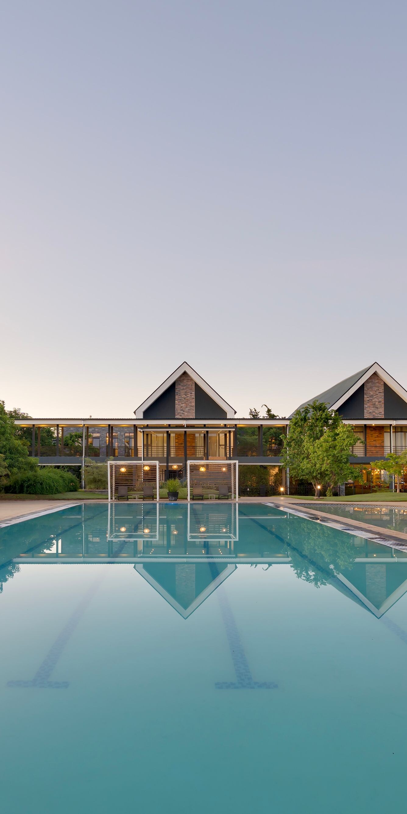 Resort pool with lounge chairs and calm water