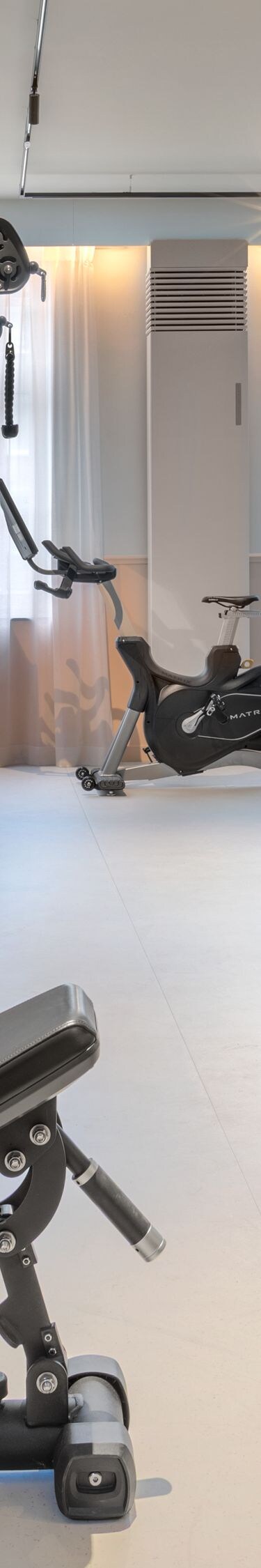 Hotel fitness room featuring exercise equipment