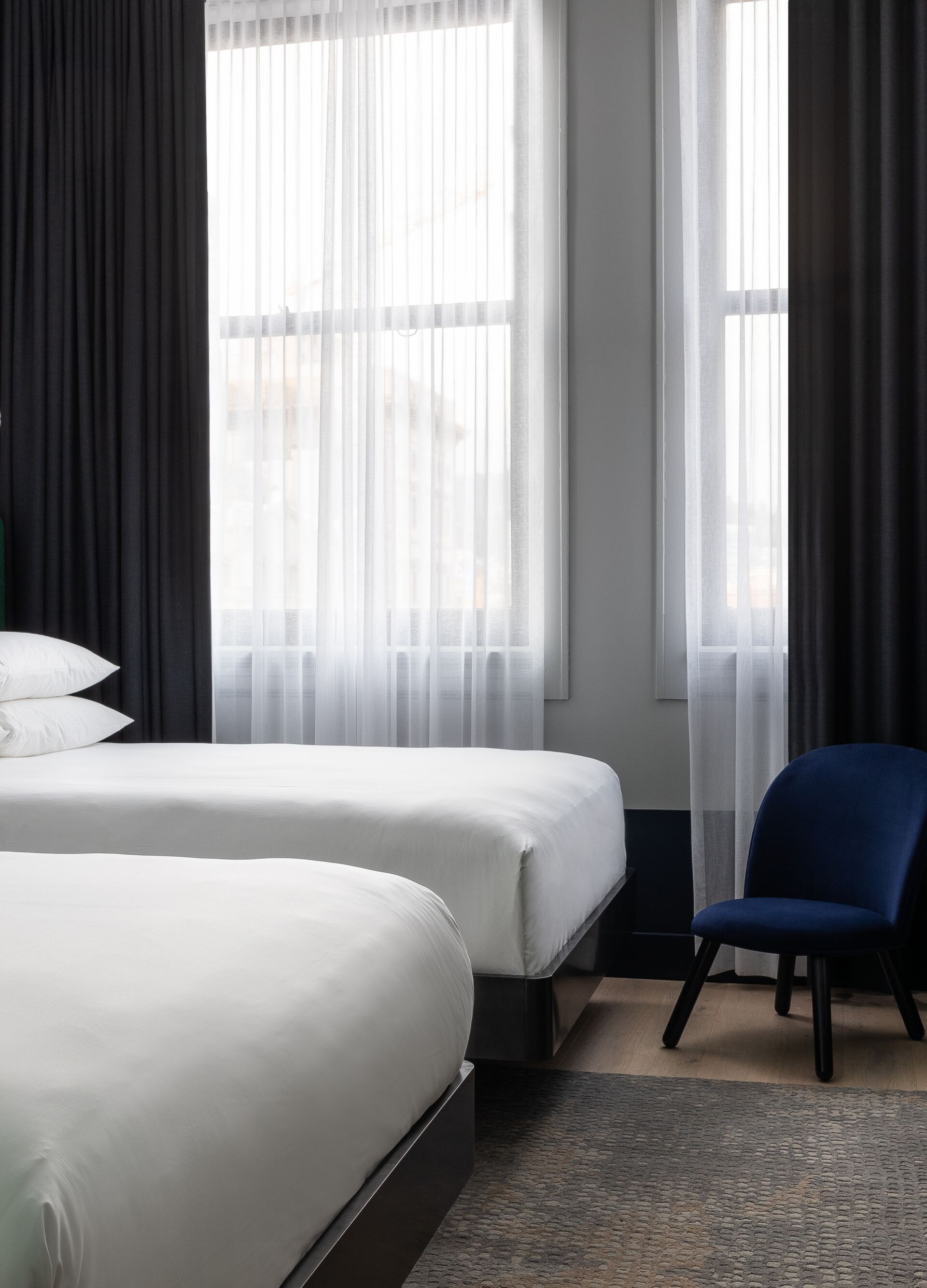 Two queen beds, cradenza, TV, chair