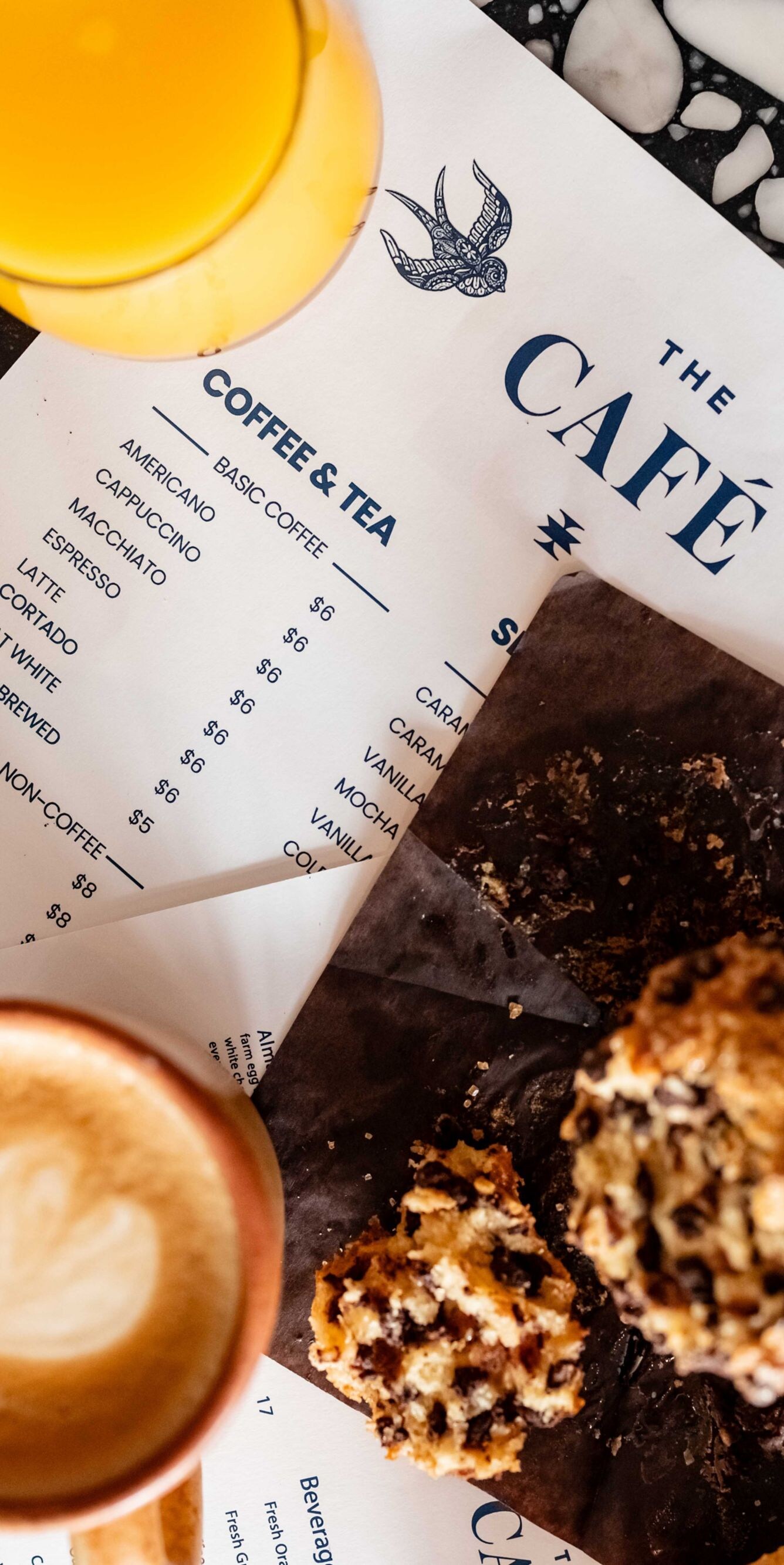 variety of pastries, coffee, and juice with menu