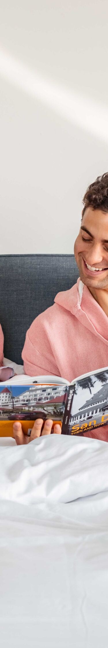 man and woman sipping espresso in bed