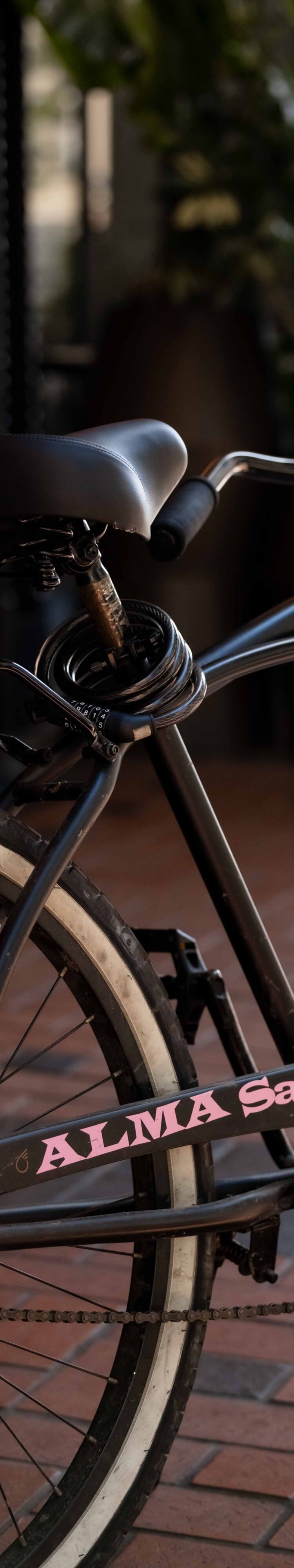 A cruiser bike parked on a sidewalk