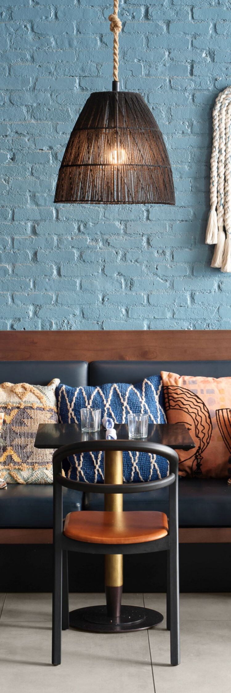 Restaurant seating with hanging lamps