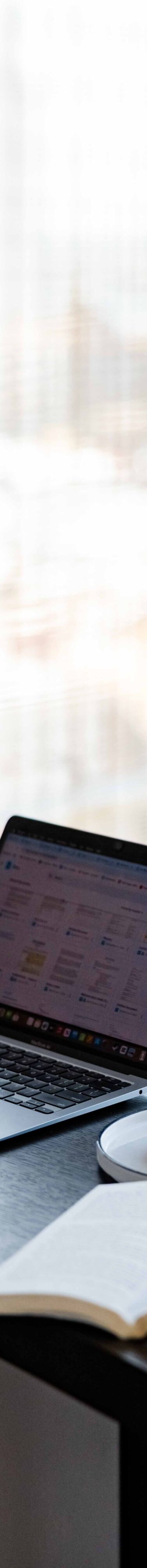 guest working on laptop at desk in loft suite