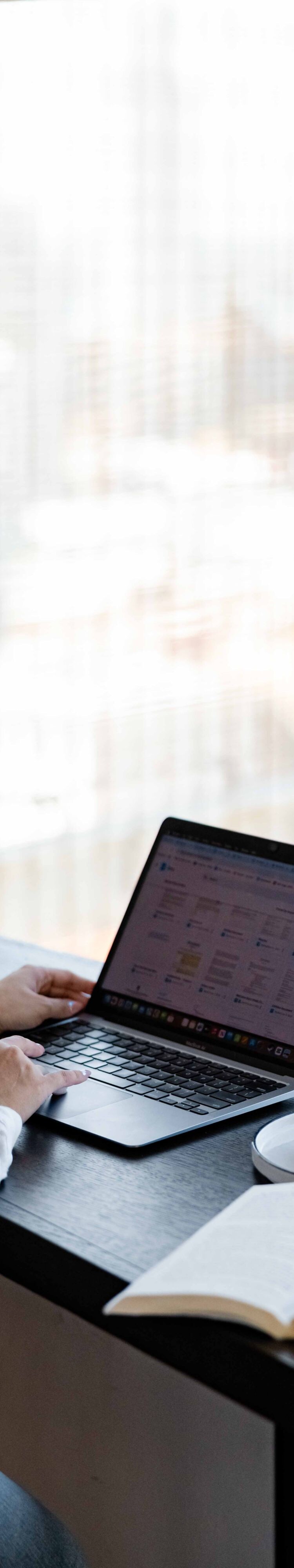 guest working on laptop at desk in loft suite