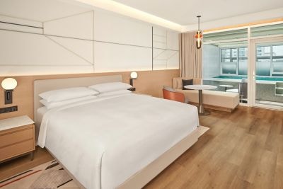 King-sized beds, sofa, seating, and TV.