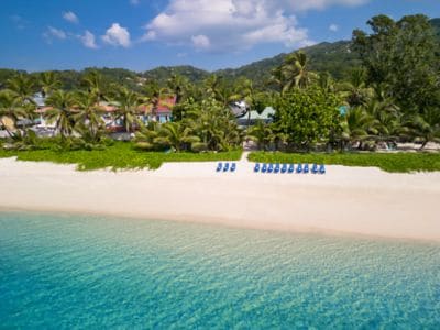 Kafe Kreol Beach Service aerial shot with loungers