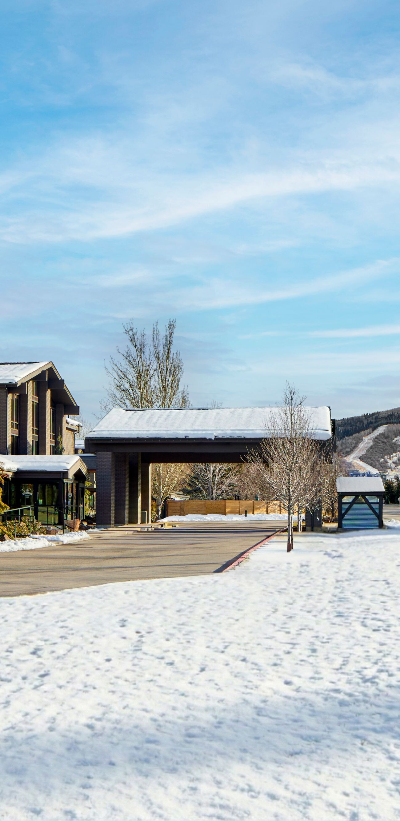 Exterior of Hotel Thaynes building with a dusting 