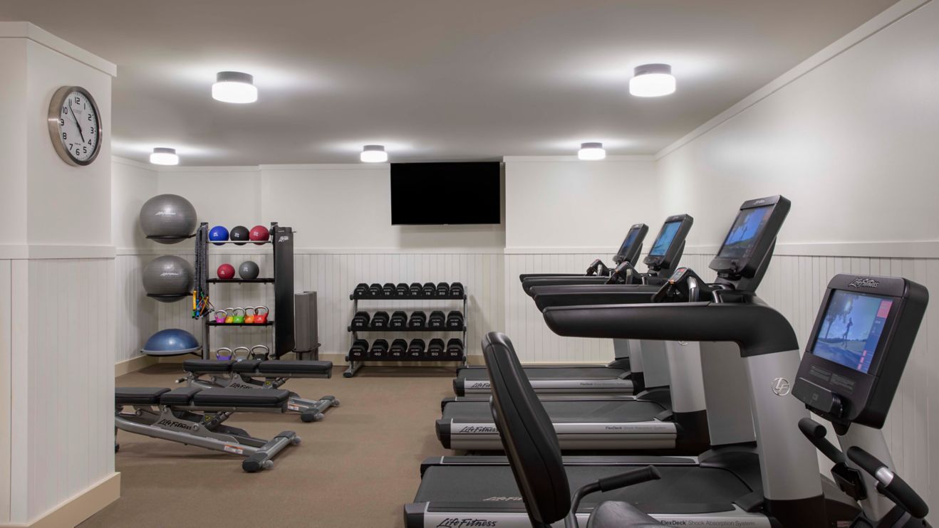 Hotel fitness center with gym equipment.