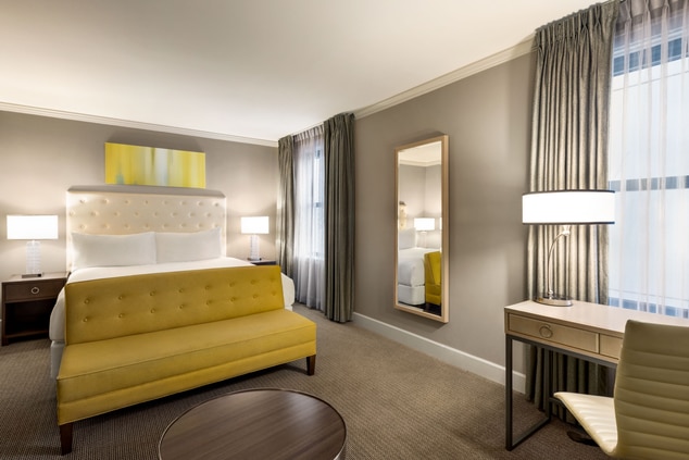 King guestroom, luxurious bedding, elegant decor