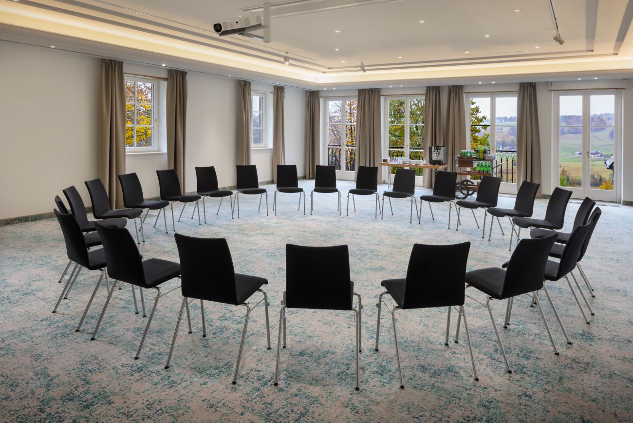 meeting space with chairs set up in a circle