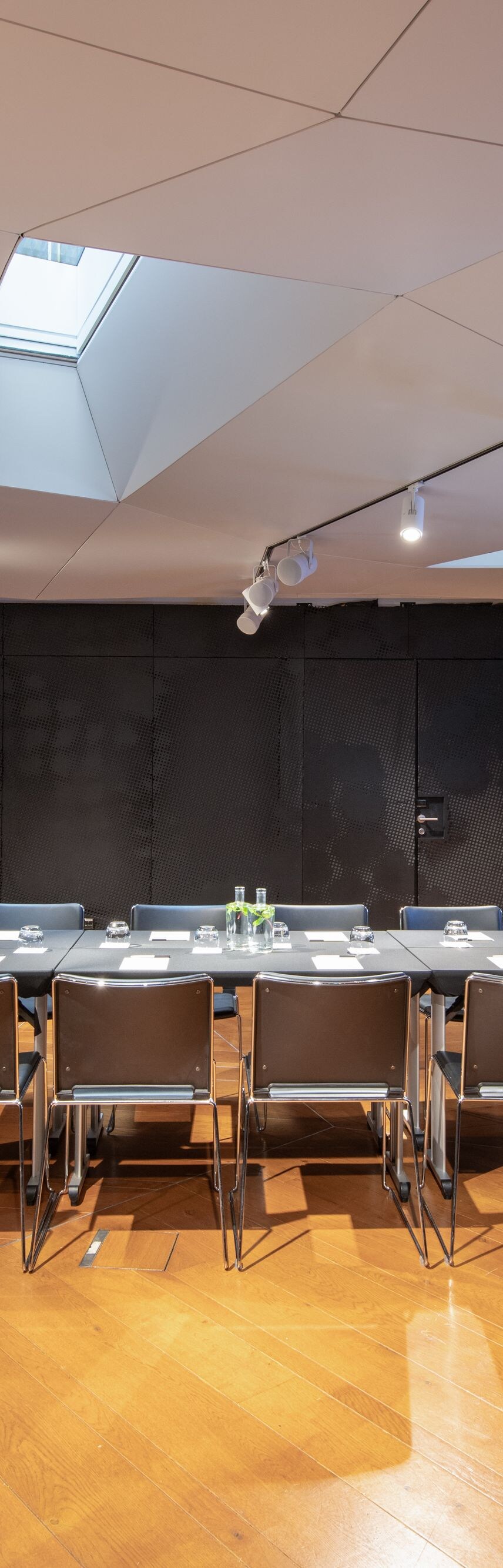 Side view of boardroom with table and chairs