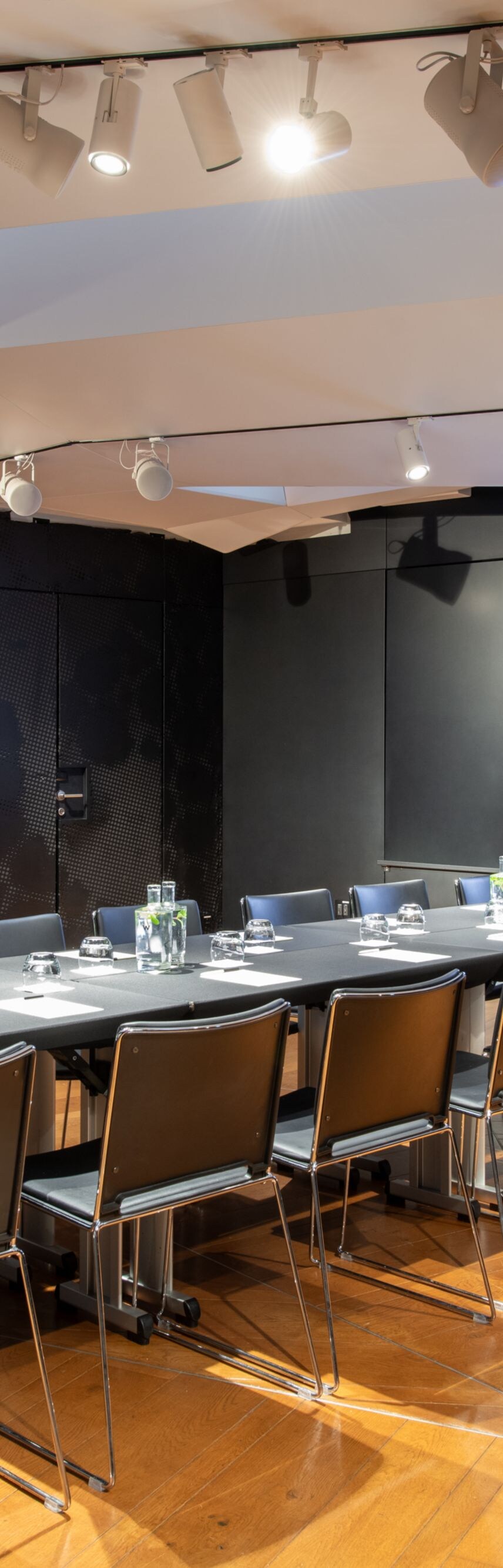 Boardroom setup with central table and chairs